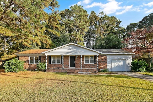 ranch-style home featuring a garage and a front yard