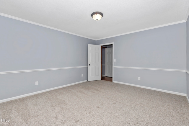 spare room with carpet floors and ornamental molding