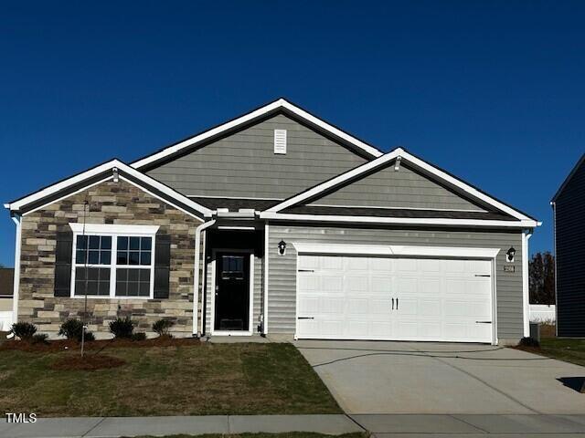 craftsman inspired home with a garage