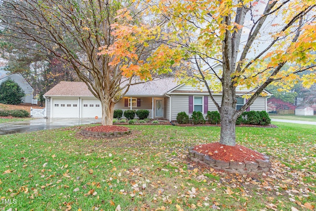 ranch-style home with a front yard and a garage