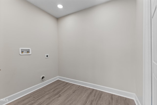 washroom featuring wood-type flooring, hookup for a washing machine, and electric dryer hookup