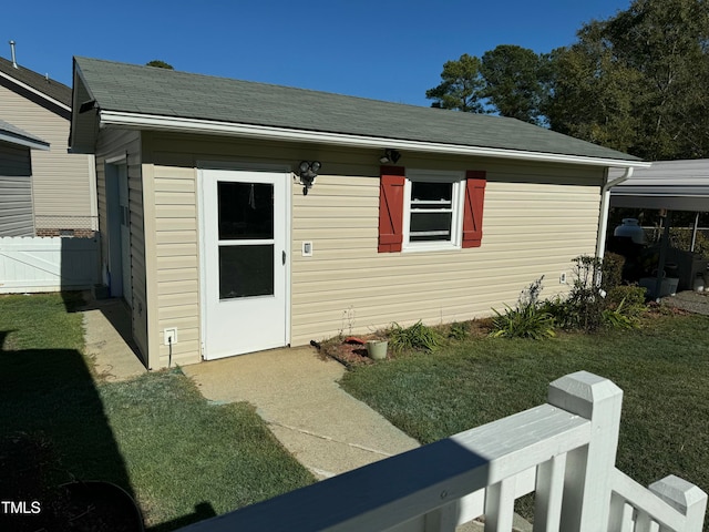 entrance to property with a yard