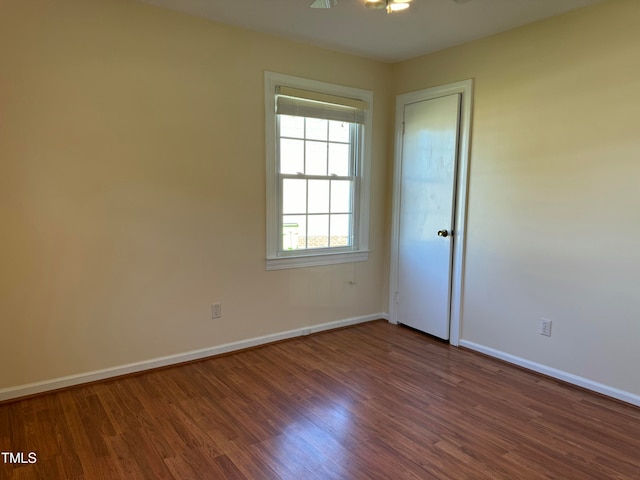 unfurnished room with ceiling fan and hardwood / wood-style floors