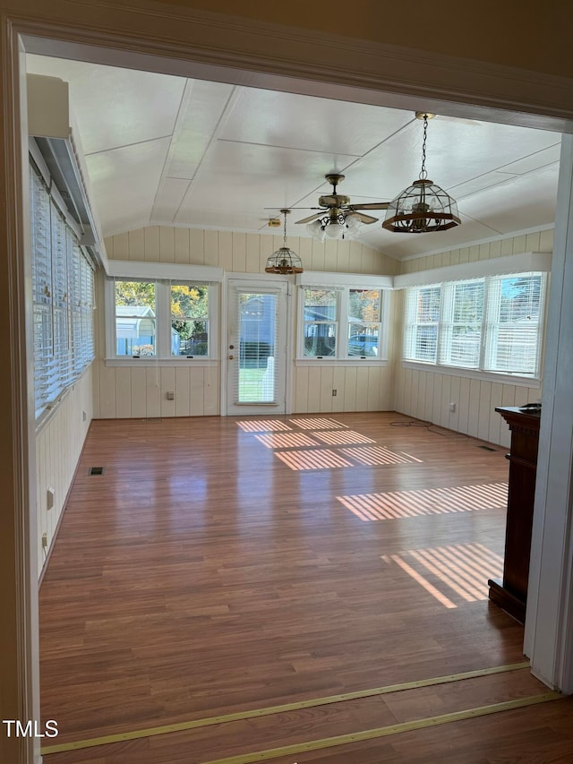 unfurnished sunroom featuring ceiling fan and lofted ceiling