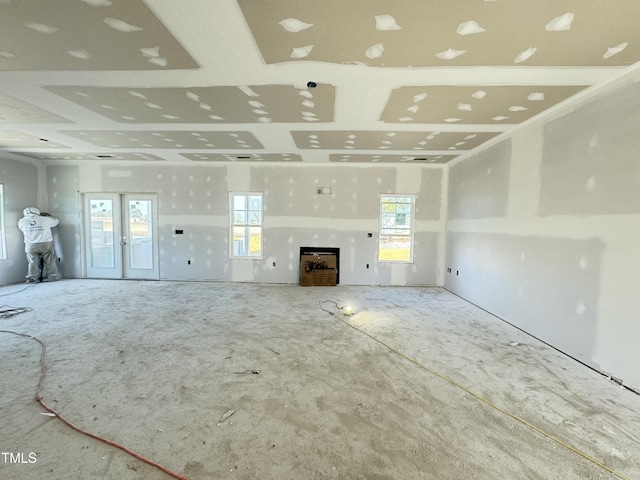 unfurnished living room with a healthy amount of sunlight