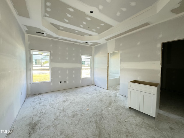 empty room with a raised ceiling