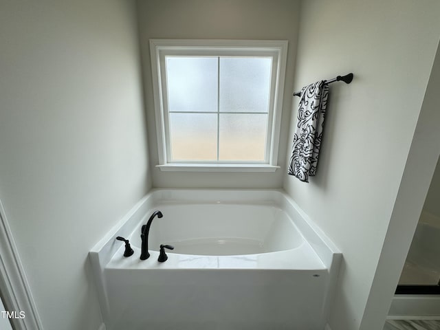 bathroom featuring a garden tub