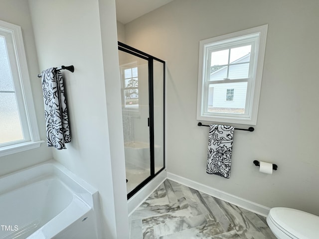 full bathroom with a healthy amount of sunlight, a stall shower, and marble finish floor