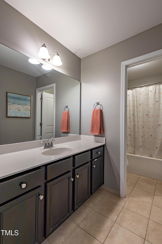 bathroom featuring tile patterned flooring, vanity, shower / bathtub combination with curtain, and a notable chandelier