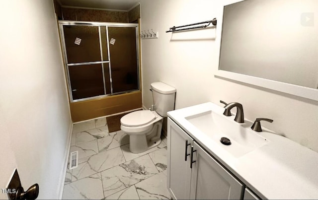 full bathroom with vanity, toilet, and bath / shower combo with glass door