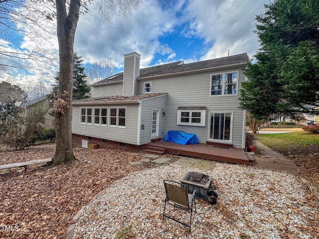 back of property featuring a wooden deck