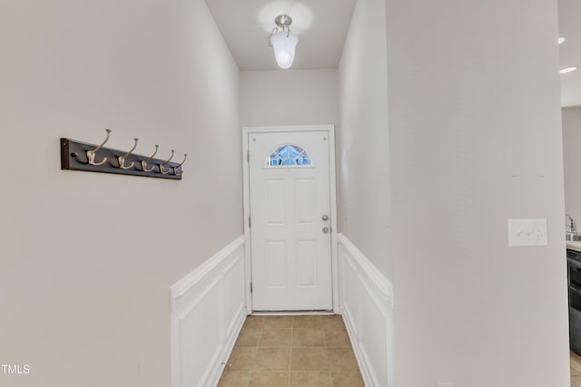 doorway featuring light tile patterned floors