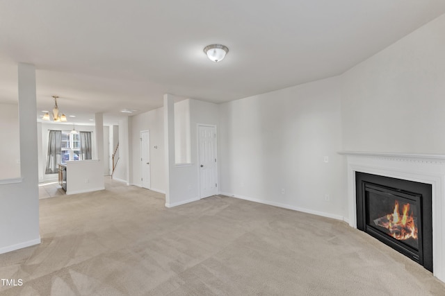 unfurnished living room with light carpet and a notable chandelier