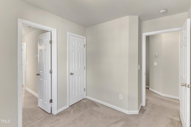 unfurnished bedroom with light carpet