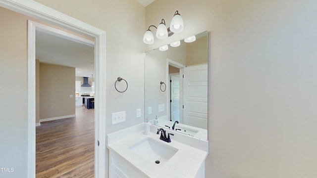 1407 Stoney Creek Church Rd, Goldsboro, NC 27534 - bathroom featuring wood finished floors, vanity, and baseboards