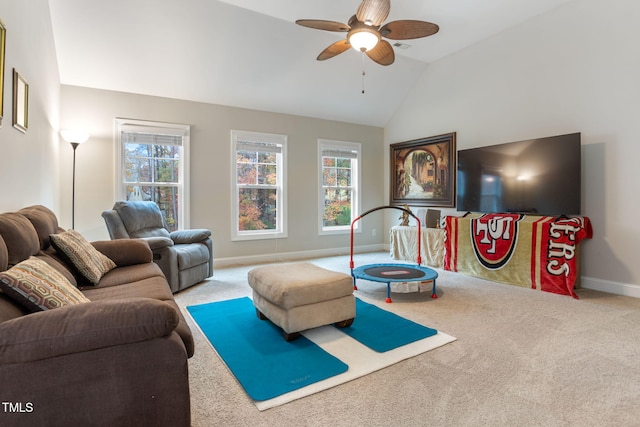 carpeted living room featuring vaulted ceiling, ceiling fan, and plenty of natural light