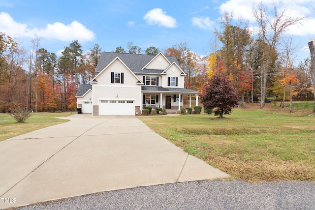 view of front of home with a porch, a garage, and a front yard