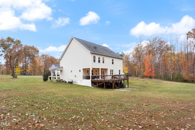 back of house with a wooden deck and a yard