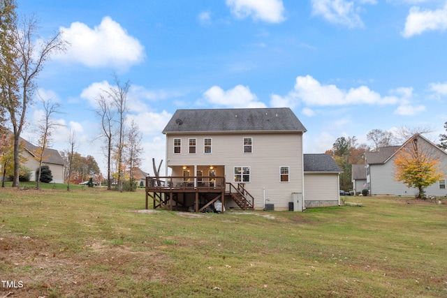 back of house featuring a yard and a deck