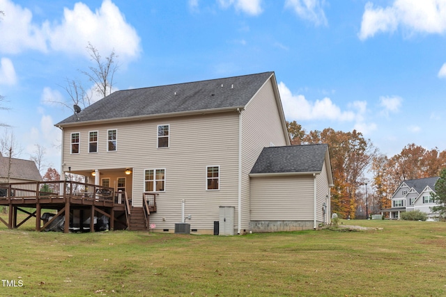 back of property with a wooden deck, central AC unit, and a lawn