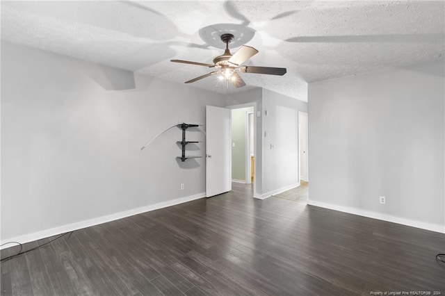 unfurnished room with a textured ceiling, dark hardwood / wood-style floors, and ceiling fan