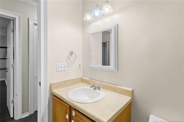 bathroom with hardwood / wood-style floors and vanity