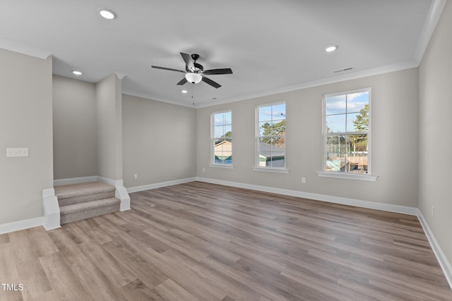 unfurnished living room featuring ceiling fan, light wood-type flooring, and crown molding