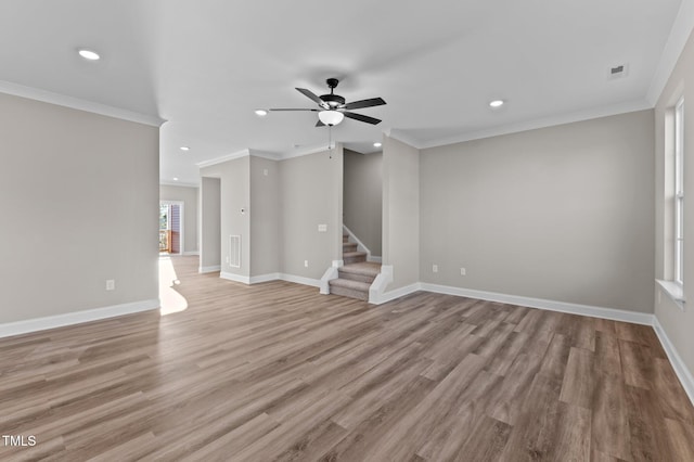 unfurnished living room with ceiling fan, light wood-type flooring, and crown molding