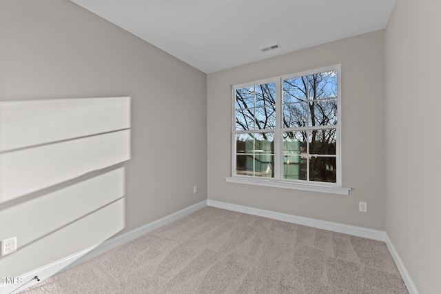 empty room featuring light carpet