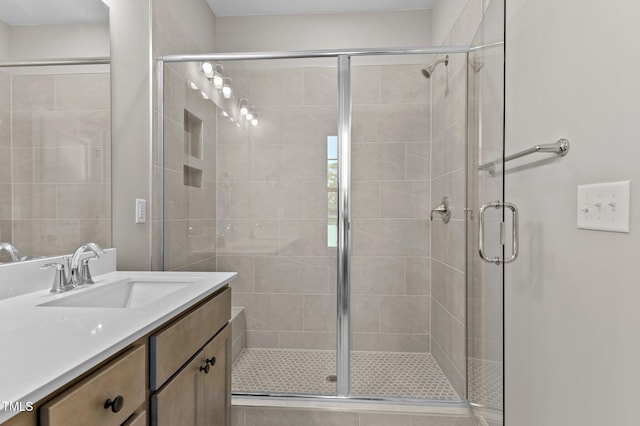 bathroom with vanity and walk in shower