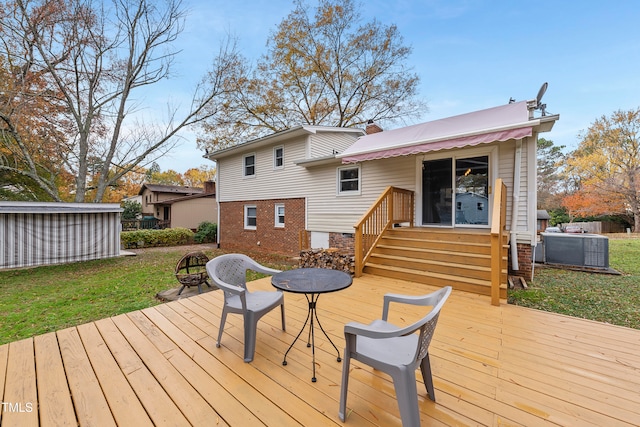 wooden terrace with central AC and a yard