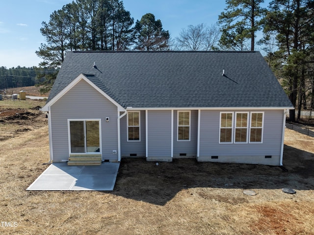 back of house featuring a patio, a shingled roof, and crawl space