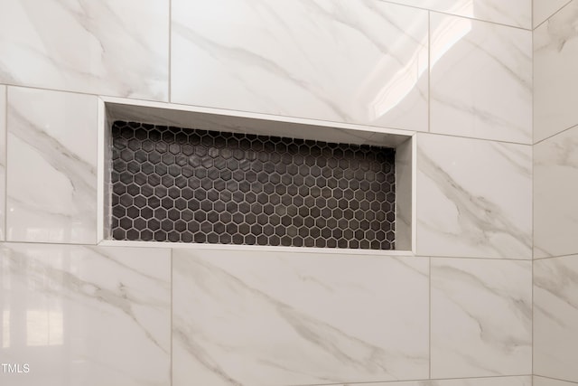 details featuring a tile shower