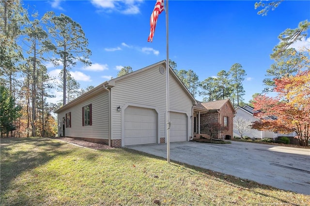 view of front of property with a front lawn and a garage