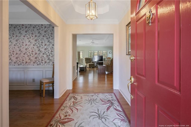 entrance foyer featuring hardwood / wood-style floors and ceiling fan with notable chandelier