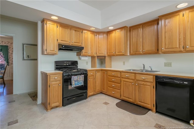 kitchen featuring black appliances, light tile patterned floors, and sink