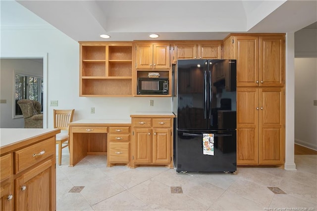 kitchen featuring crown molding, light tile patterned flooring, and black appliances