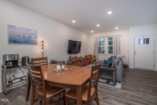 dining area with hardwood / wood-style flooring