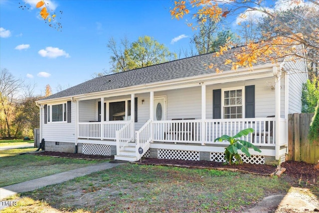 ranch-style home with a porch and a front yard