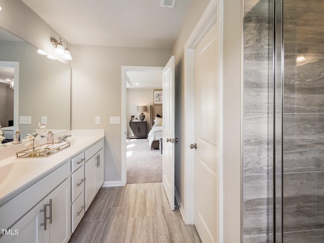 bathroom featuring vanity and wood-type flooring