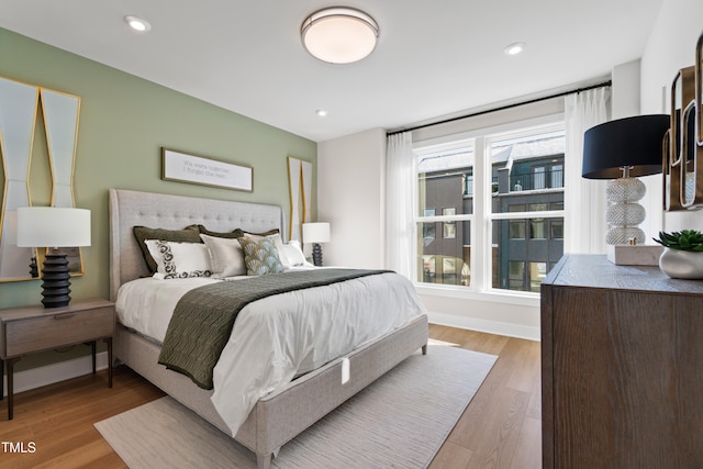 bedroom with wood-type flooring