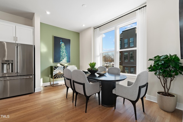 dining room with light wood-type flooring