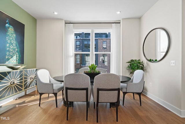 dining room featuring wood-type flooring