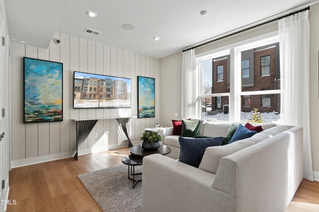 living room with light hardwood / wood-style floors