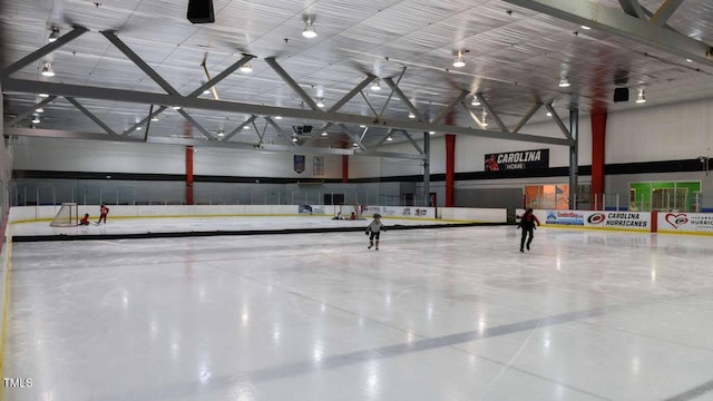 interior space featuring a high ceiling and concrete floors