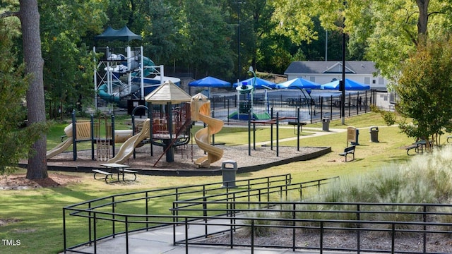 view of jungle gym with a lawn