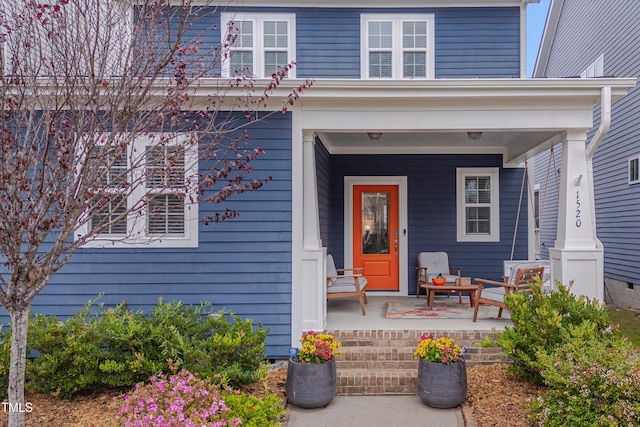 entrance to property featuring covered porch