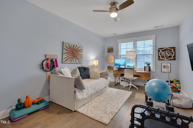 home office featuring hardwood / wood-style flooring and ceiling fan