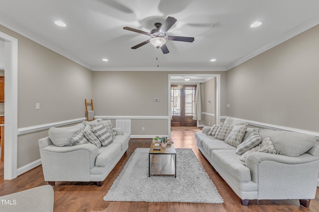 living room with hardwood / wood-style flooring, ceiling fan, ornamental molding, and french doors