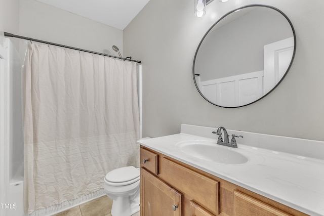 full bathroom featuring toilet, vanity, tile patterned floors, and shower / bathtub combination with curtain